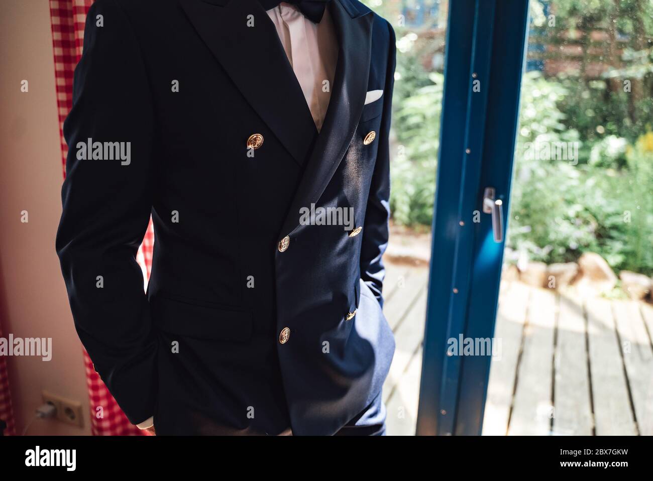 Closeup shot of elegant man in business suit. Dark blue jacket with