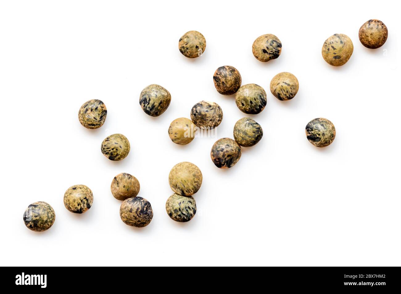 French green or le puy lentils scattered.  Isolated on white, top view. Stock Photo