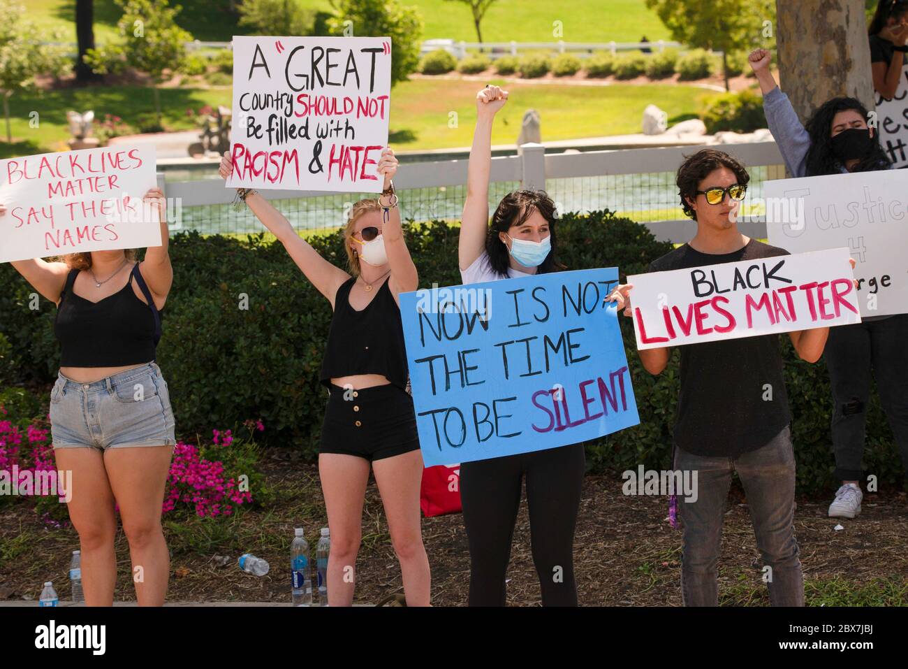 Protesors at a corner in Temecula, California, USA on June 3, 2020 to call for justice for George Floyd and all black lives lost to police brutality. Stock Photo