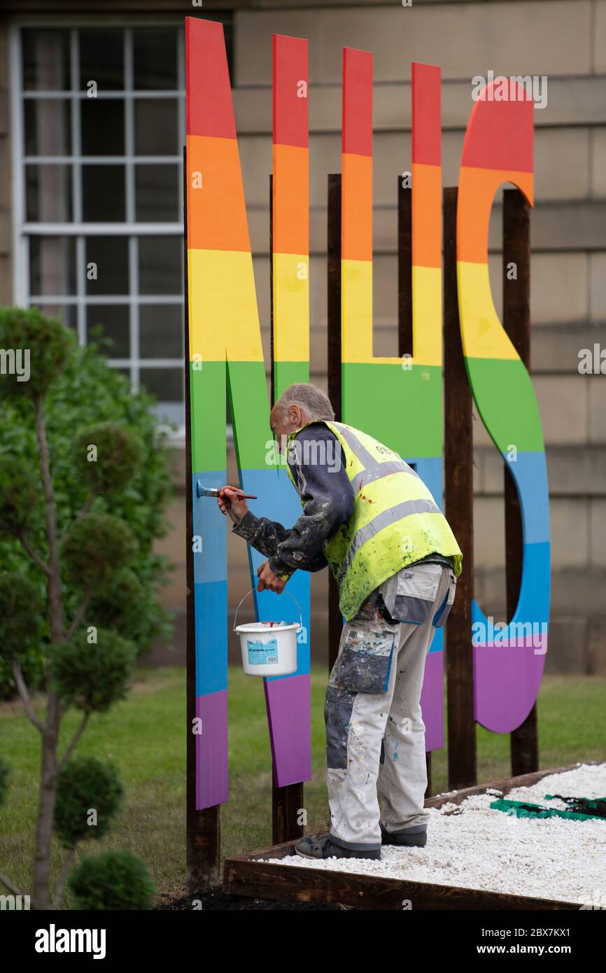 Bury, UK. 5th June, 2020. Picture shows an NHS sign being painted in raibow colours outside Bury Town Hall, Bury, UK. Credit: Jon Super/Alamy Stock Photo
