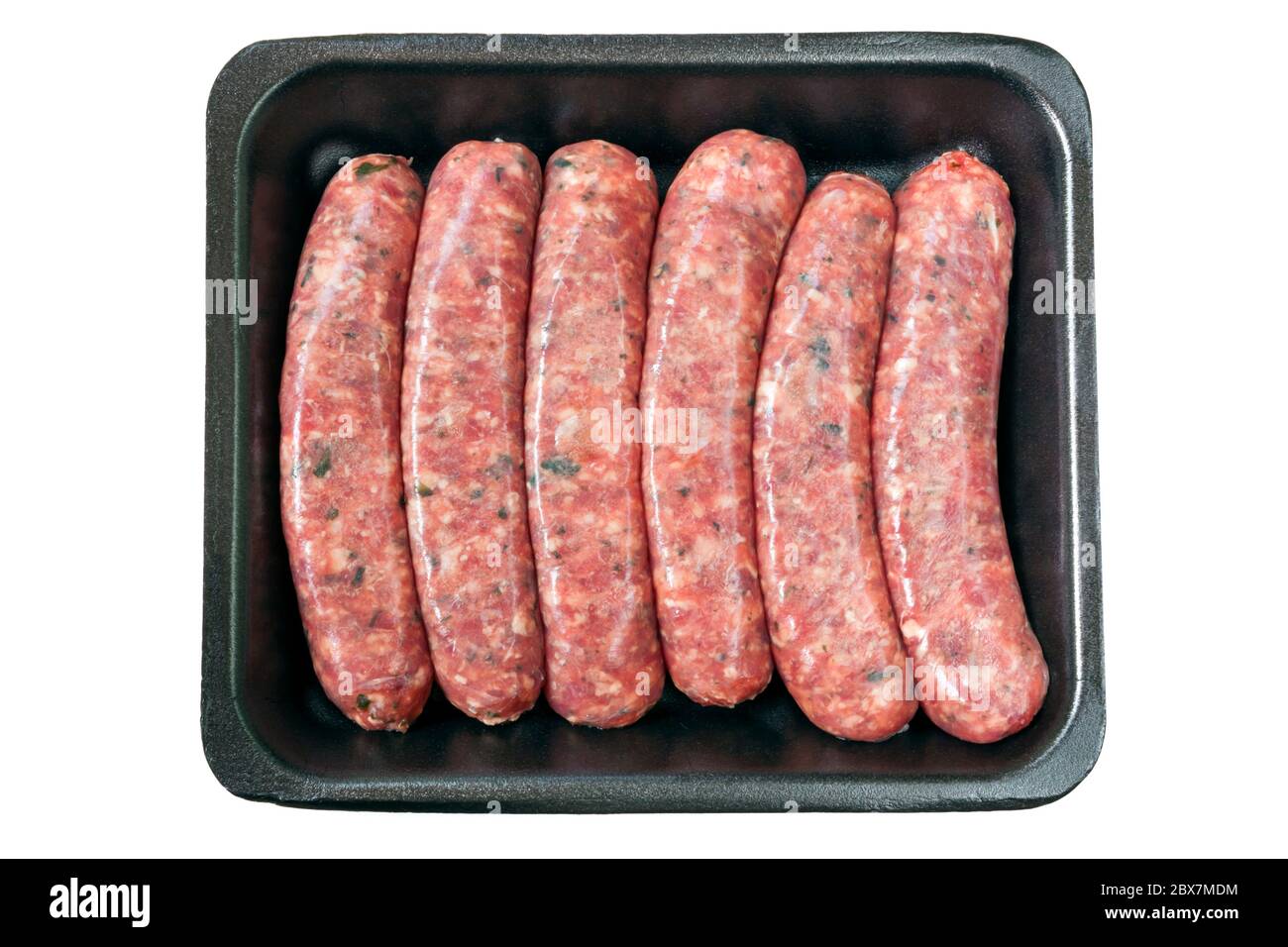 Raw sausages on styrofoam tray, isolated on white. Stock Photo