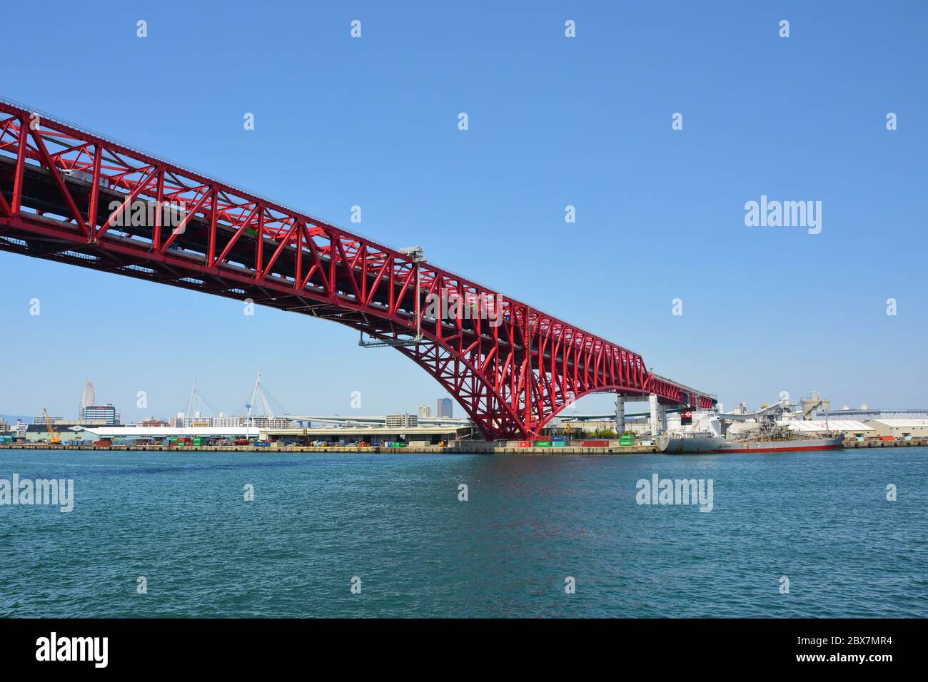 Red bridge cross the sea in Osaka Stock Photo - Alamy