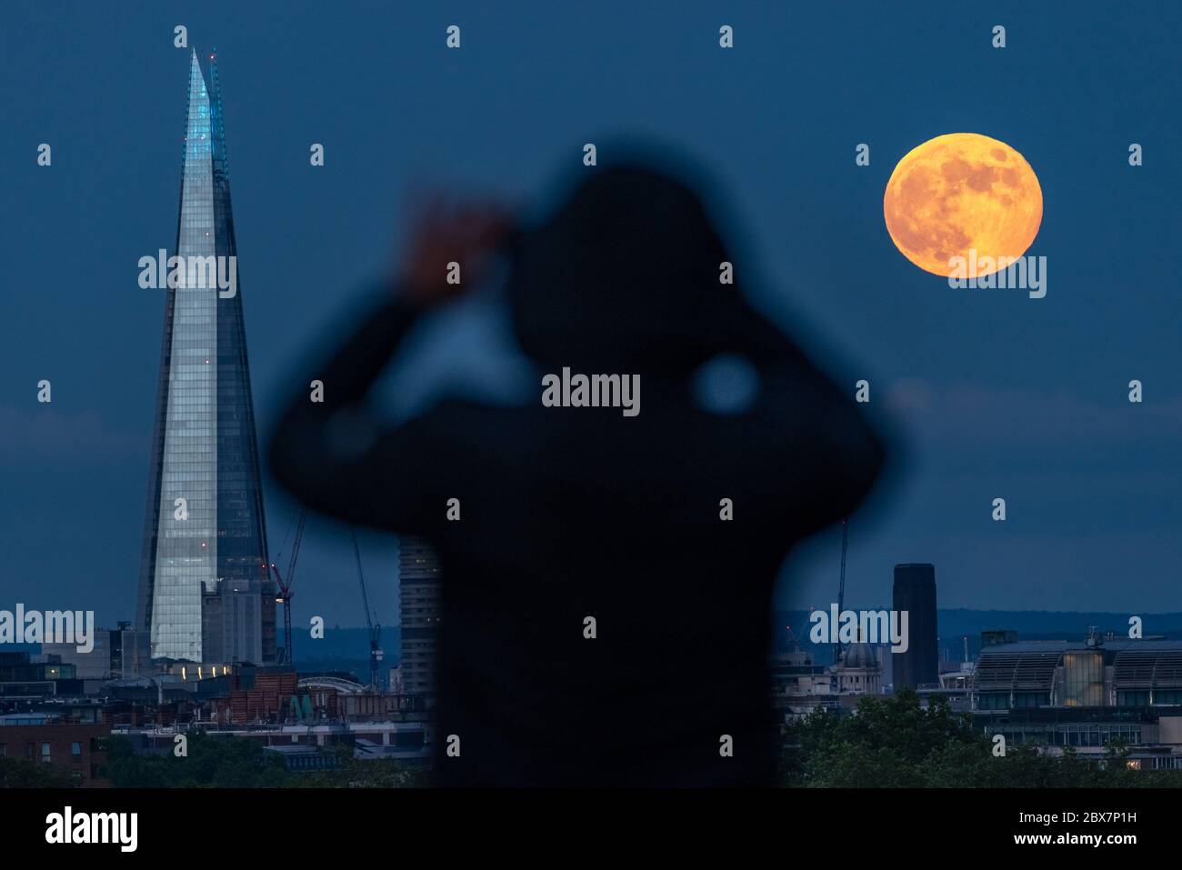 London, UK. 5th June, 2020. UK Weather Full Strawberry Moon rises over