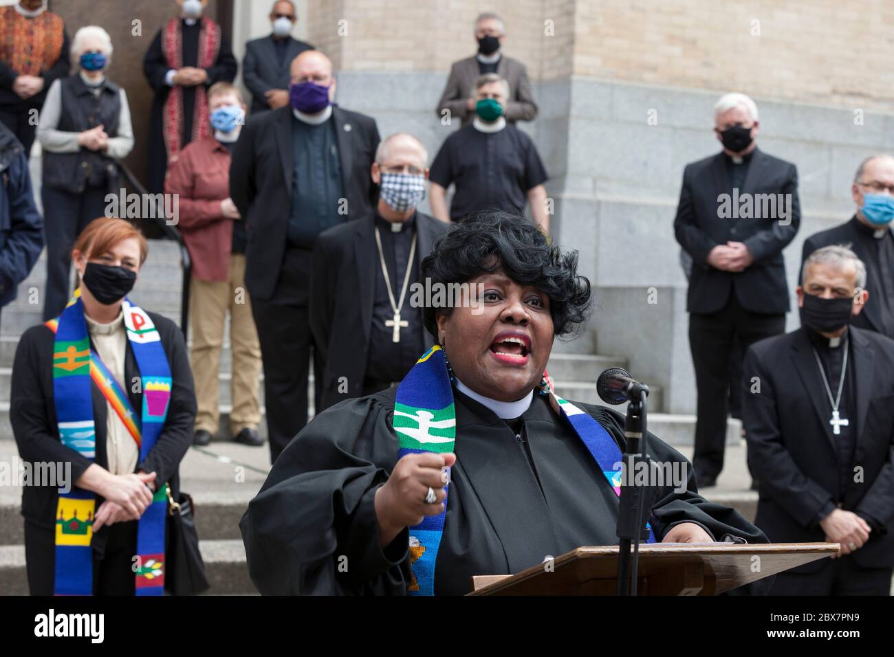 The Reverend Dr. KELLE BROWN speaks of systematic racial inequality during a vigil at St. James Cathedral in Seattle on Friday, June 5, 2020. Clergy from many faith traditions gathered for 'A Moment of Prayer and Lament' to pray and observe eight minutes, 46 seconds of silence in remembrance of George Floyd. Brown is the lead pastor with the Plymouth Church of Seattle. Stock Photo