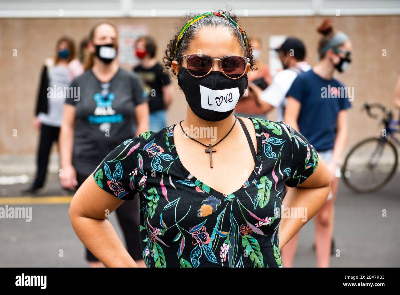Philadelphia, PA / USA. About two dozen people gathered at the corner of Kensington and Allegheny Avenues for a prayer vigil for the city. Wearing masks and observing social distancing, participants taped faith-inspired words over their mouths. June 04 2020. Credit: Christopher Evens / Alamy Live News Stock Photo