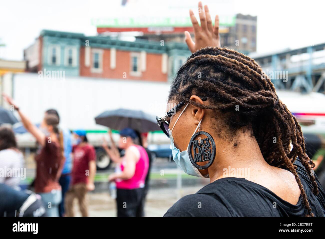 Philadelphia, PA / USA. About two dozen people gathered at the corner of Kensington and Allegheny Avenues for a prayer vigil for the city. Wearing masks and observing social distancing, participants taped faith-inspired words over their mouths. June 04 2020. Credit: Christopher Evens / Alamy Live News Stock Photo