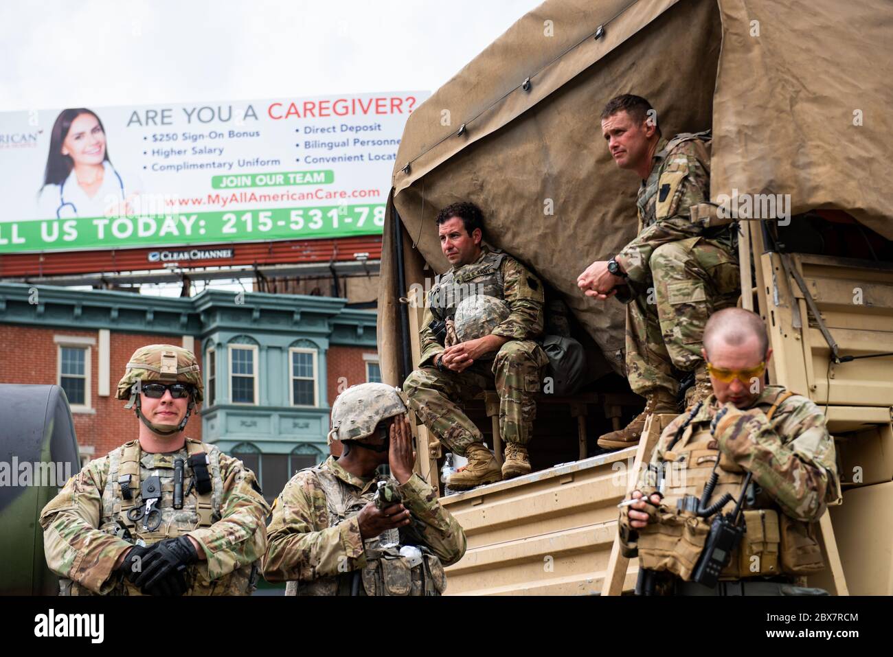 Philadelphia, PA / USA. National Guards stationed in Kensington stand guard during a prayer vigil at the corner of Kensington and Allegheny Avenues. June 04 2020. Credit: Christopher Evens / Alamy Live News Stock Photo