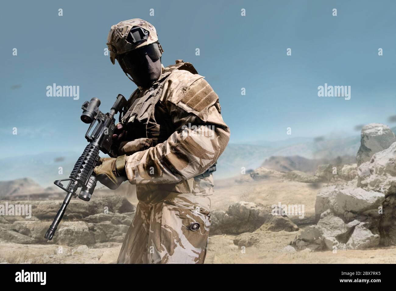 Profile View Military Fully Equipped Soldier In Outfit Posing With Rifle On Desert Background