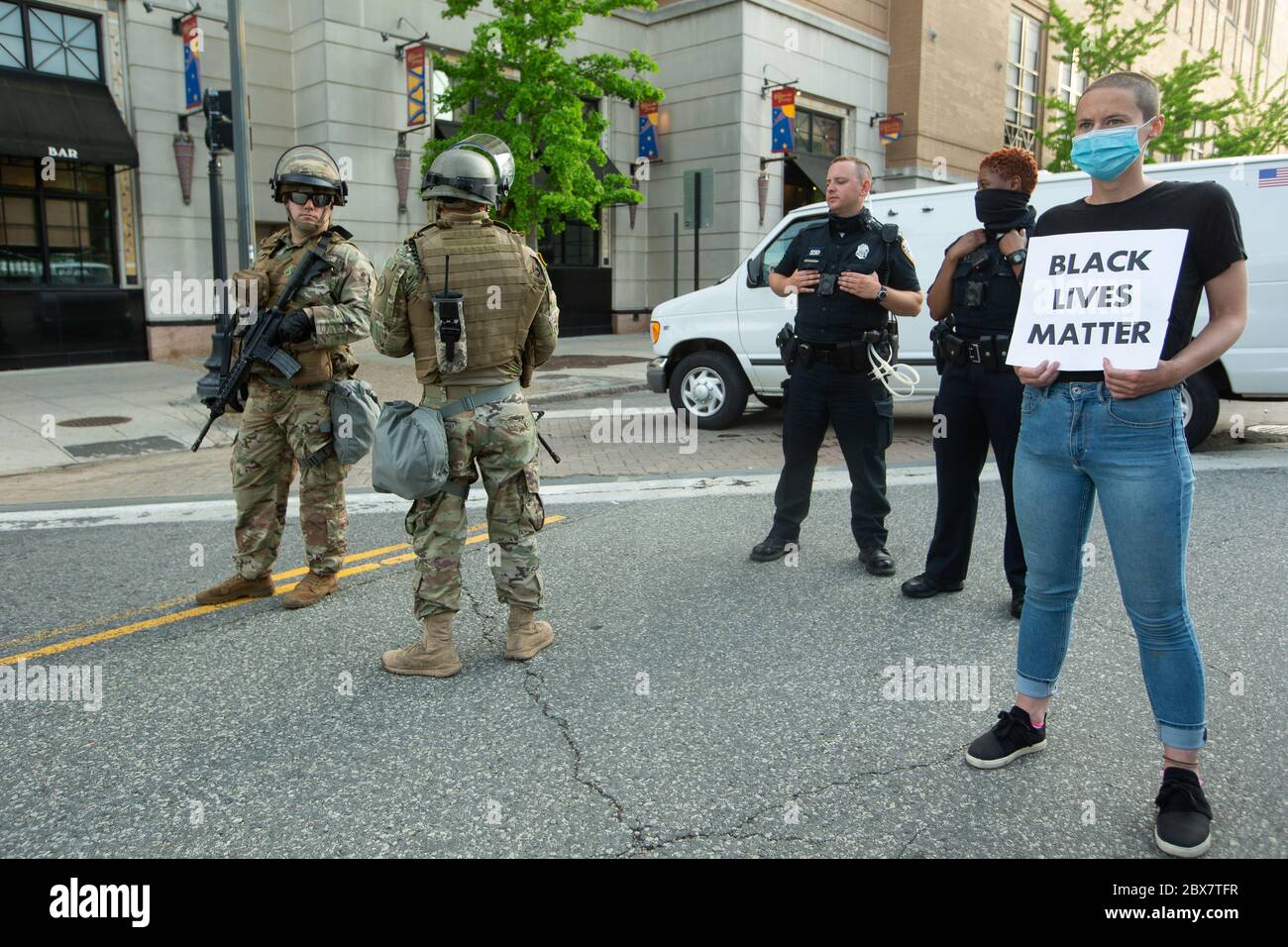 Providence, United States. 05th June, 2020. Demonstrators holds a Black Lives Matter sign next to Providence Police and Rhode Island National guard at a BLM protest in Providence, Rhode Island on Friday, June 5, 2020. Peaceful protesting and civil unrest has broken out across the country in response to the killing of George Floyd by the police in Minneapolis on May 25. Photo by Matthew Healey/UPI Credit: UPI/Alamy Live News Stock Photo
