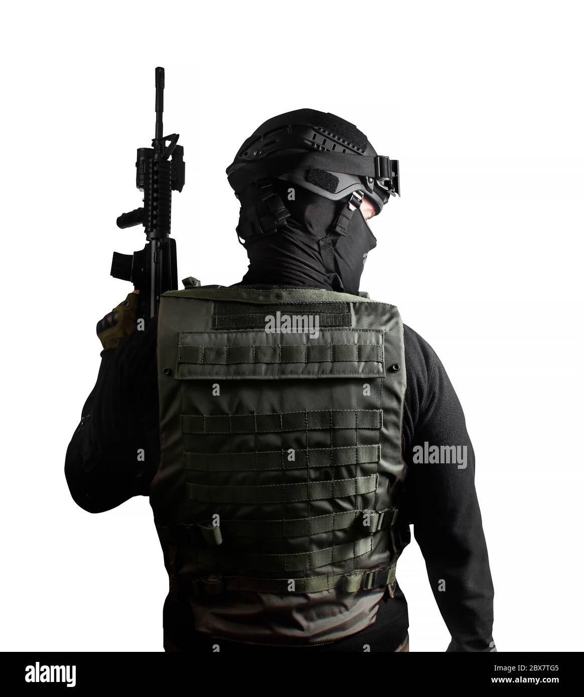 Isolated photo of a fully equipped swat soldier standing with rifle back  view pose Stock Photo - Alamy