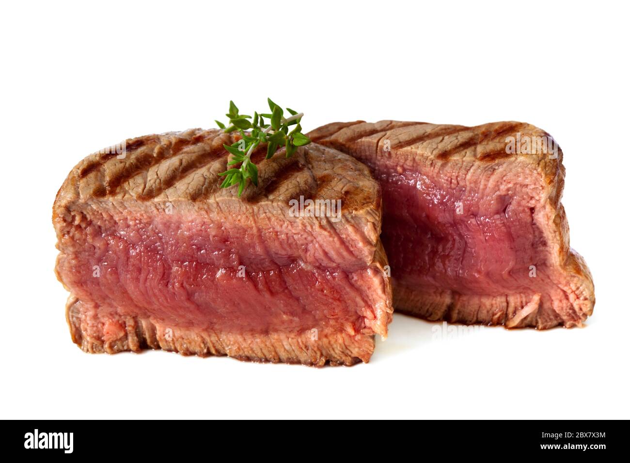 Filet mignon, chargrilled to medium rare. Isolated on white Stock