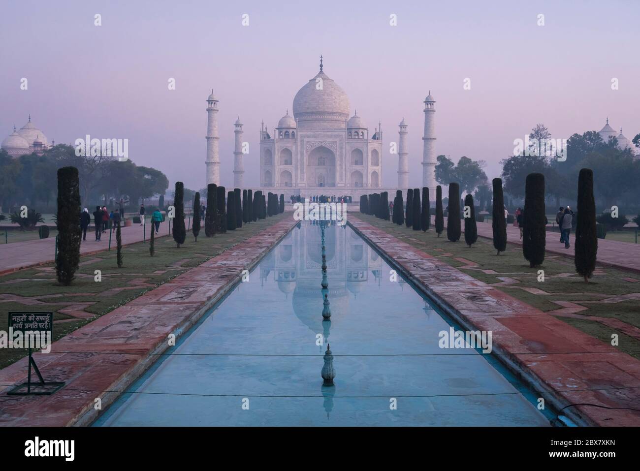 Taj Mahal and reflecting pool in dawn mist in Agra, India Stock Photo
