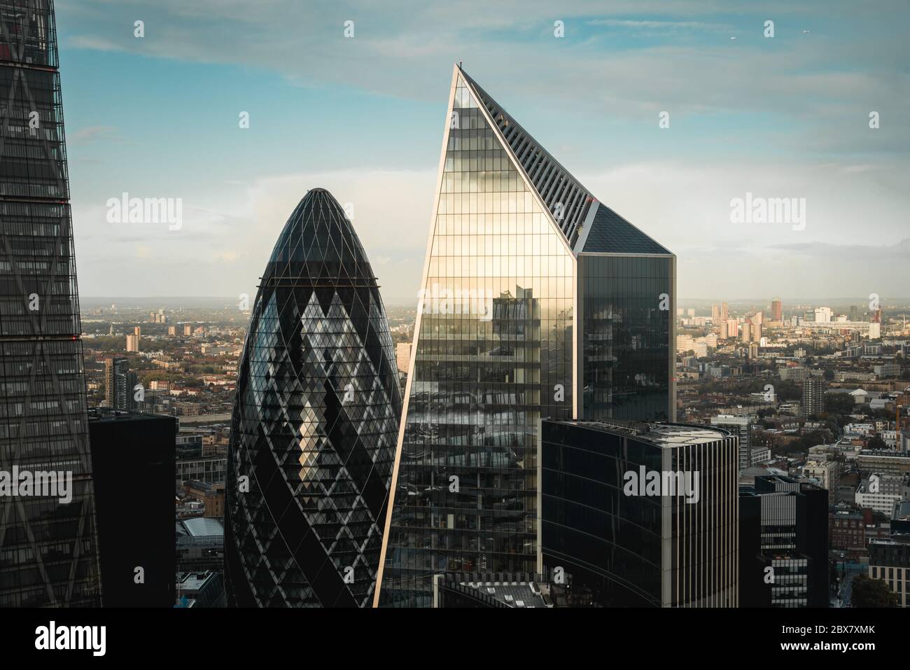 View of the 30 St. Mary Axe and the Scalpel buildings from Sky Garden during sunset in London, UK Stock Photo