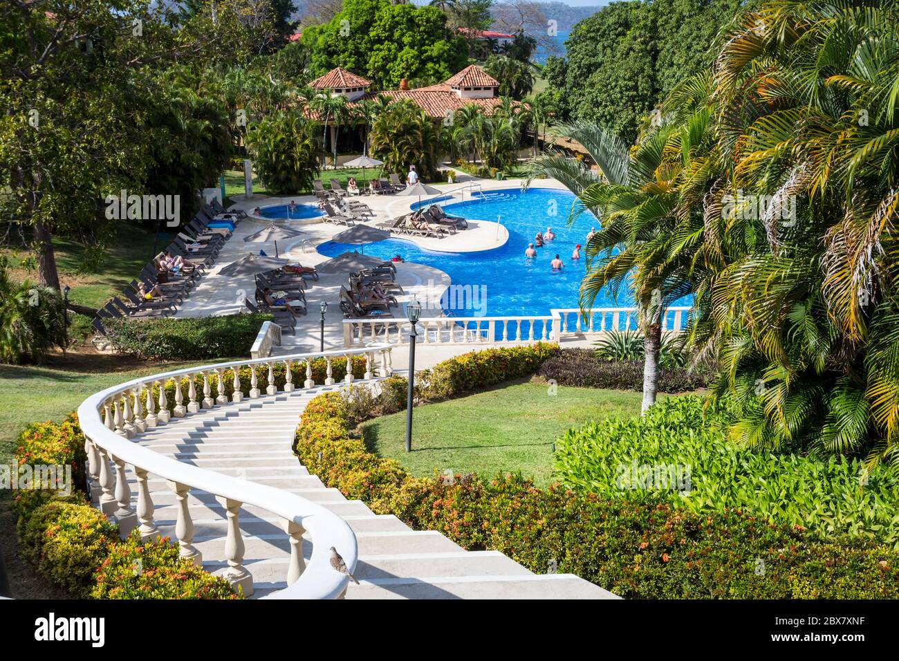 swimming pool with winding staircase, Occidental Papagayo Hotel, Guanacaste; Costa Rica; Central America Stock Photo