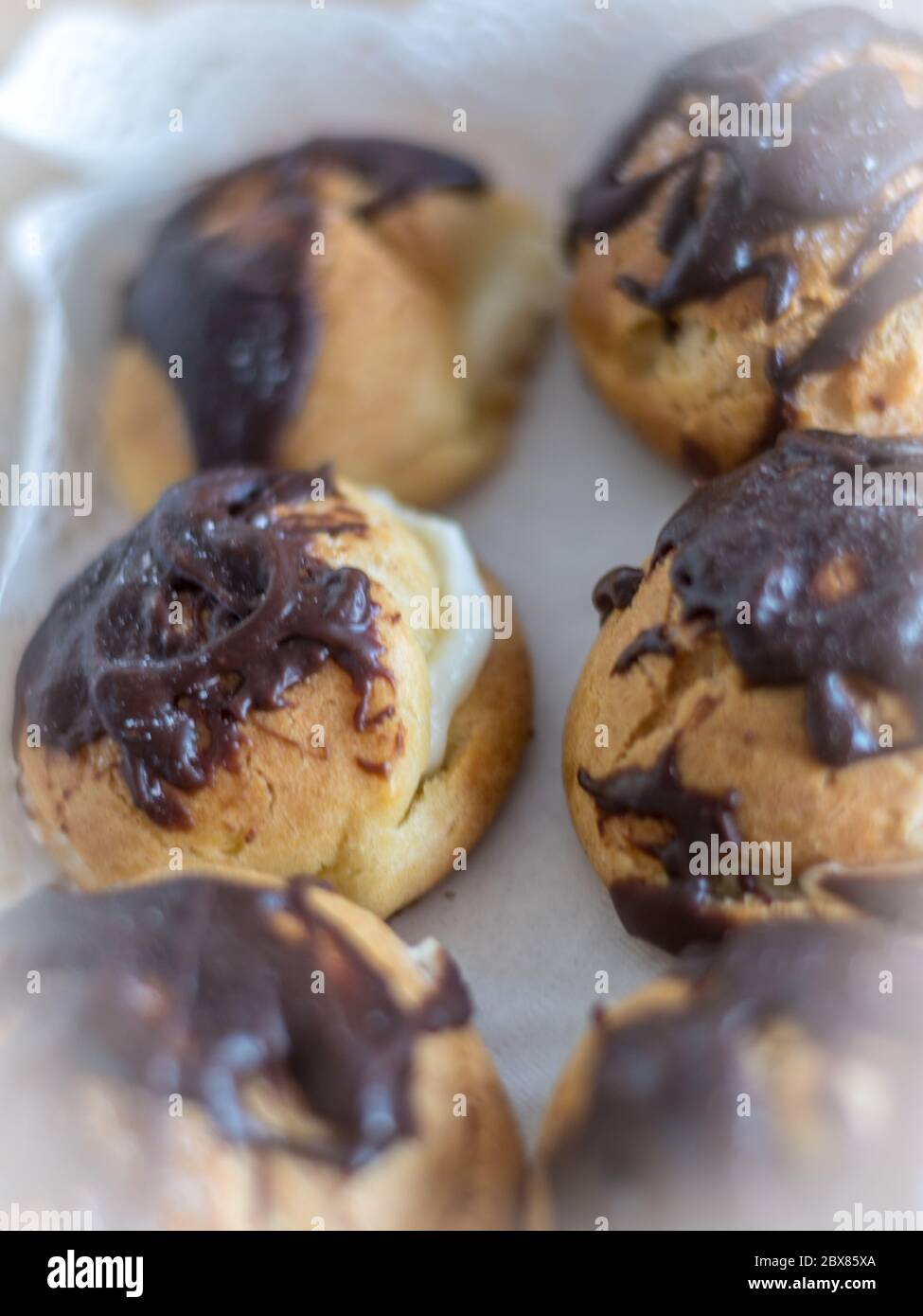 Isolated close up of delicious fresh round french eclair dessert with