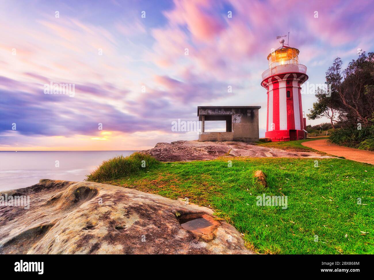 Bright coastal morning with Hornby lighthouse lighting way at the entrance to SYdney Harbour on South Headland. Stock Photo