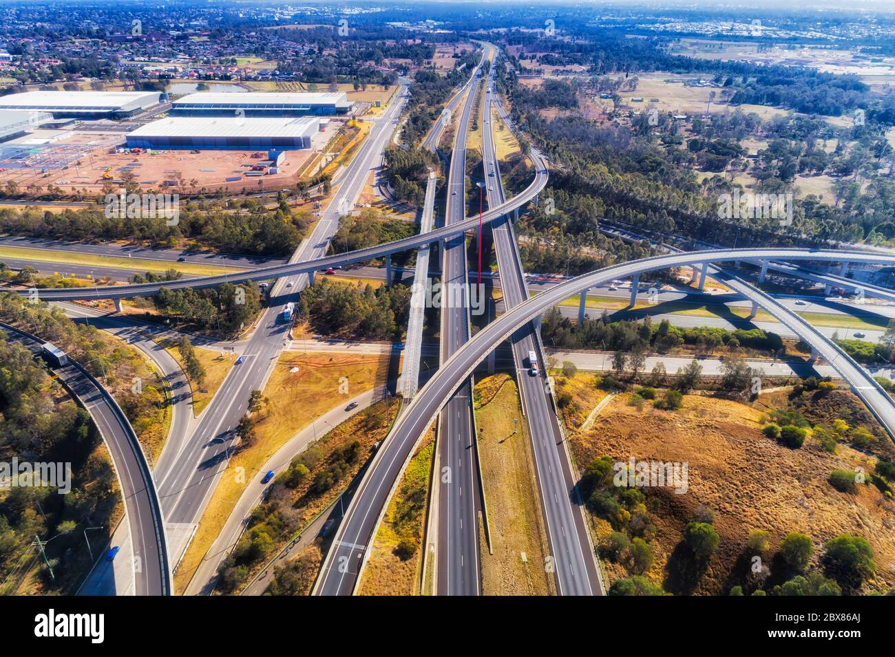 Multi lane major motorways in Western Sydney - multi level lighthorse interchange of M4 and M7 in aerial elevated view above. Stock Photo