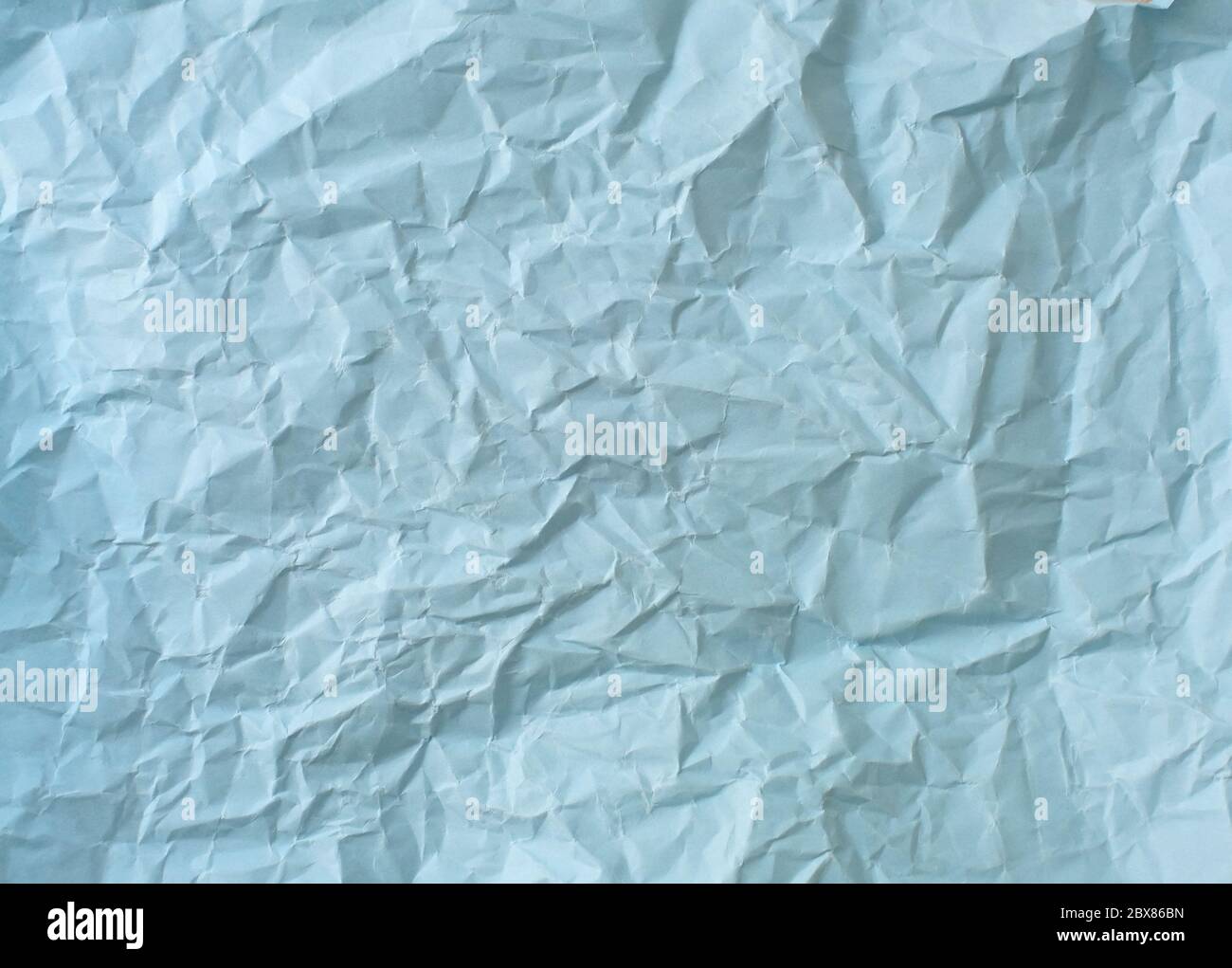 crumpled sheet of light blue paper, colored paper texture Stock Photo -  Alamy