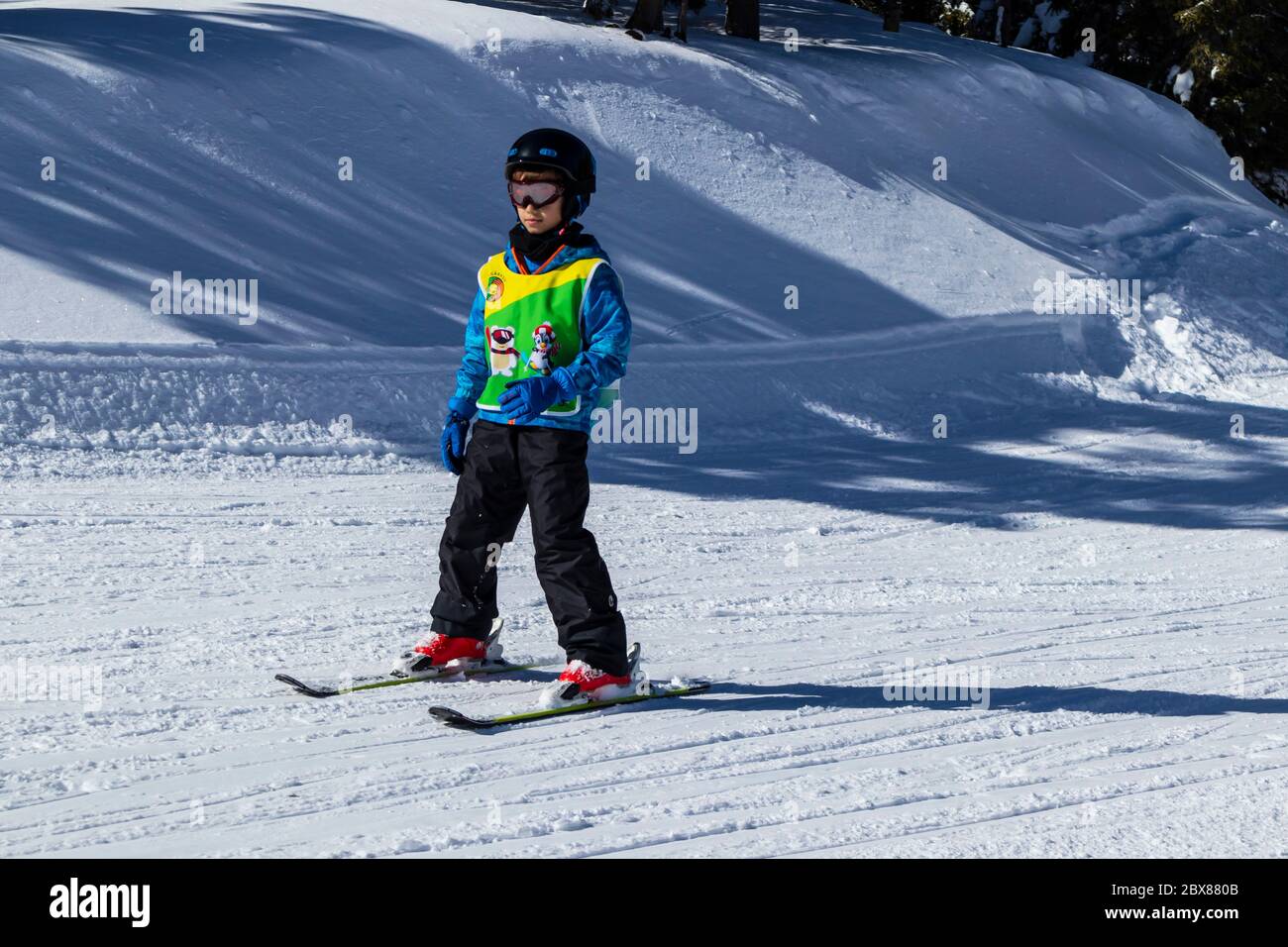 Sureanu Ski Resort, Romania - Child skiing in mountains. Ski race for young children. Winter sport for family. Kids ski lesson in alpin school Stock Photo