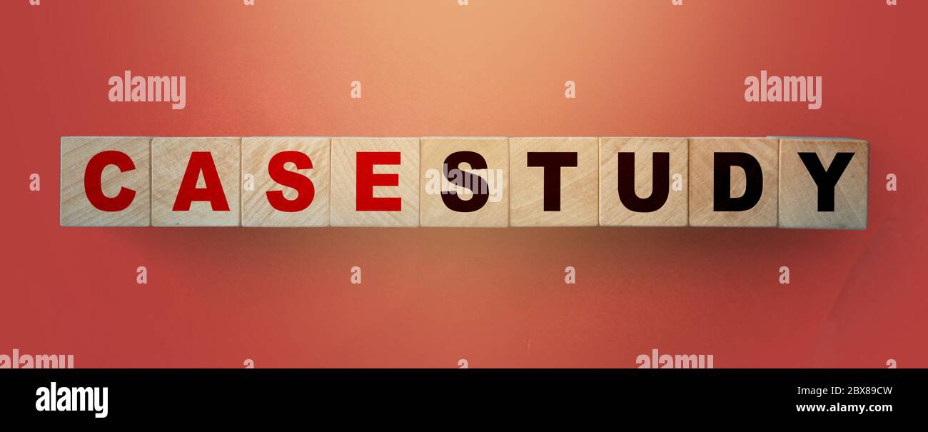 Case Study written on a wooden cube in a soft red gradient background. Examples concept Stock Photo