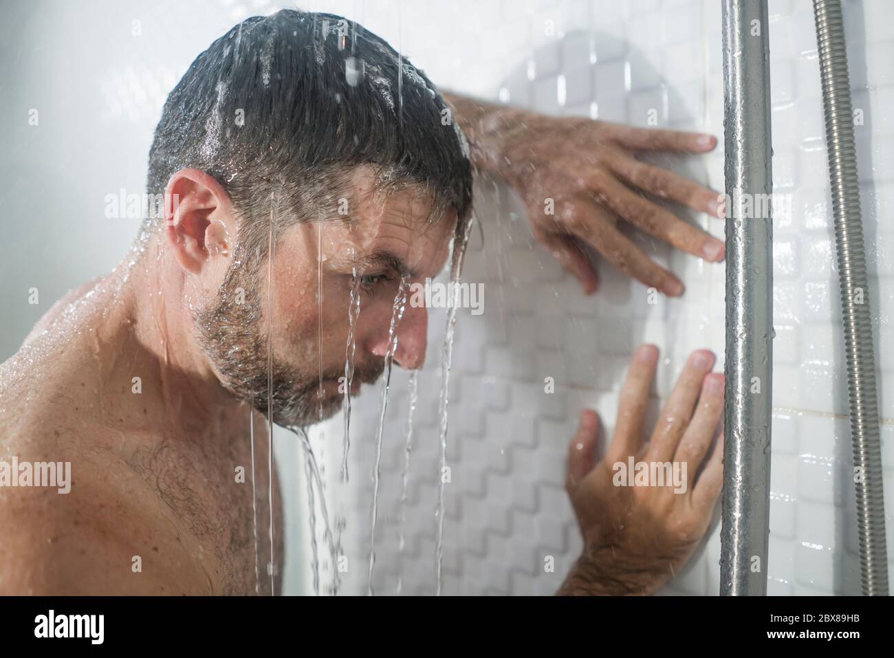 home bathroom dramatic portrait of young attractive sad and depressed