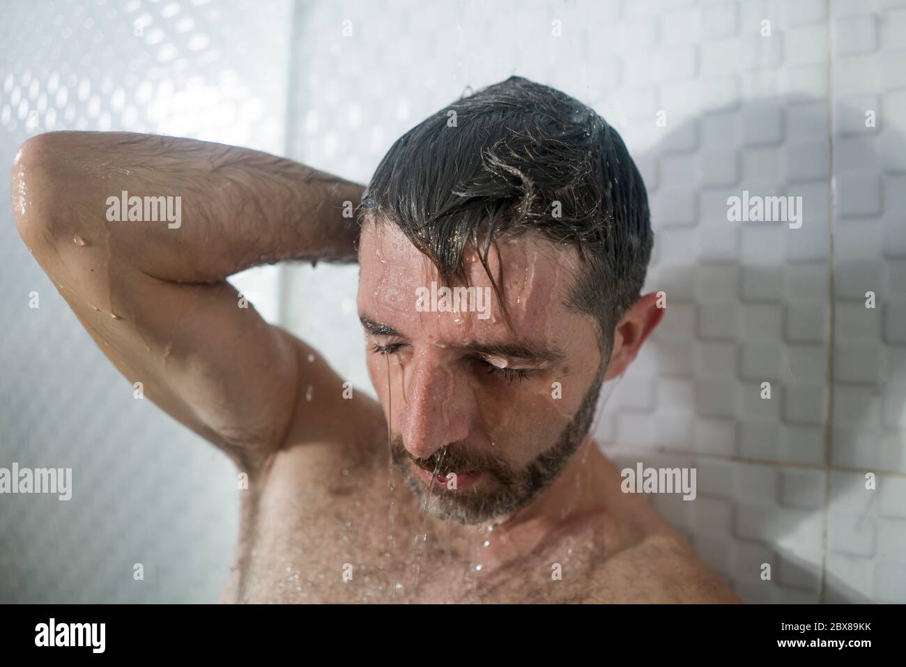 home bathroom dramatic portrait of young attractive sad and depressed