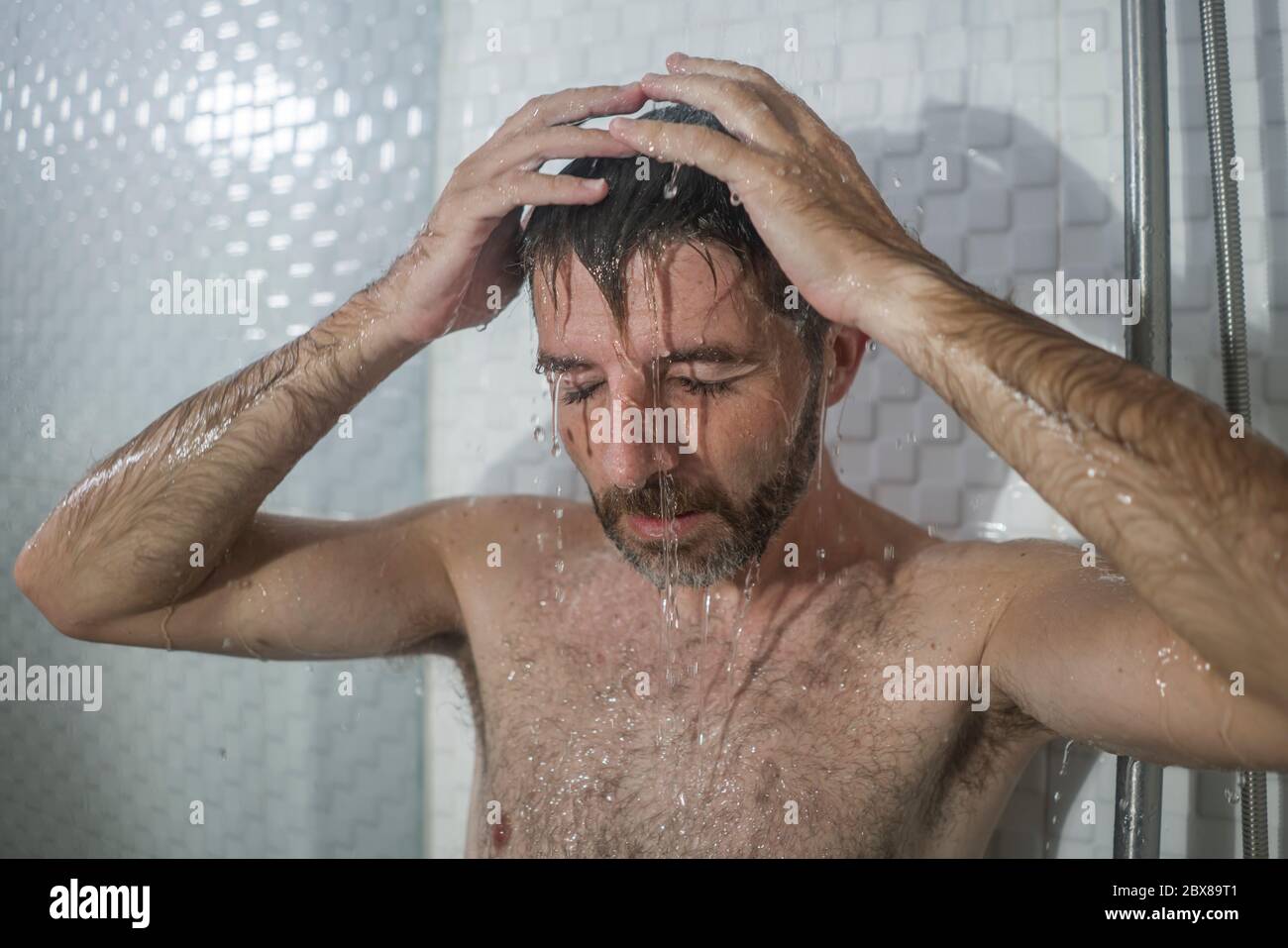 home bathroom dramatic portrait of young attractive sad and depressed