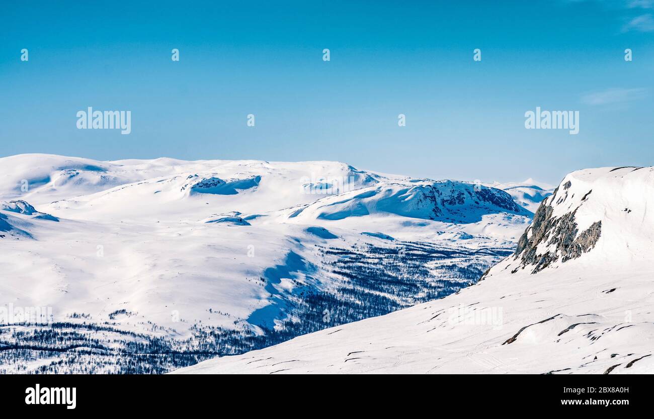 View from Swedish (Atoklinten mountain) to Norwegian side of winter mountains - feeling excited by view to beautiful mountains and northern nature. Ab Stock Photo