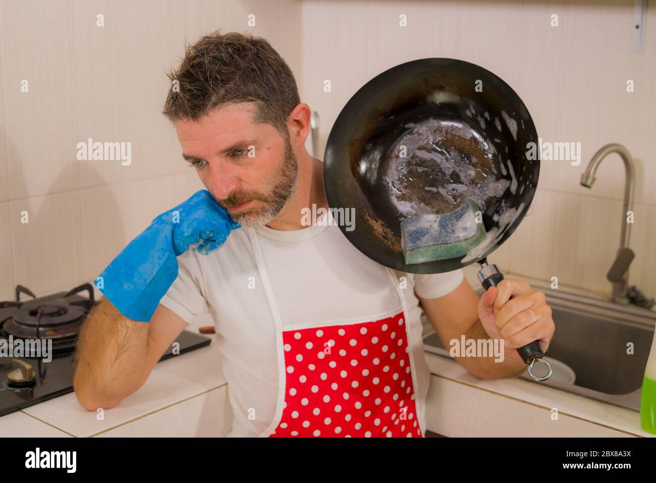 Overworked Cook domestic chores stress - lifestyle portrait of young attractive ...