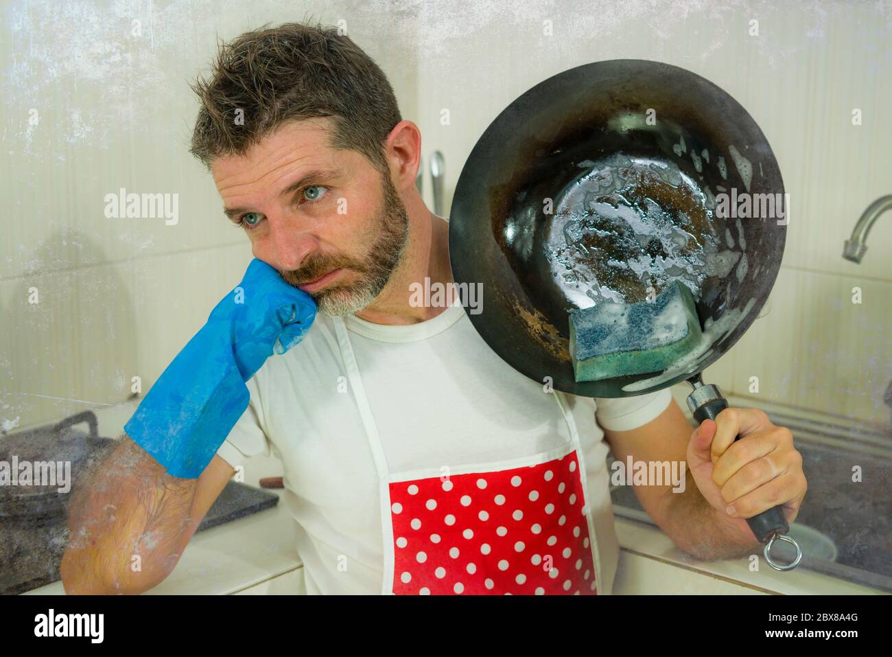 Overworked Cook domestic chores stress - lifestyle portrait of young attractive ...