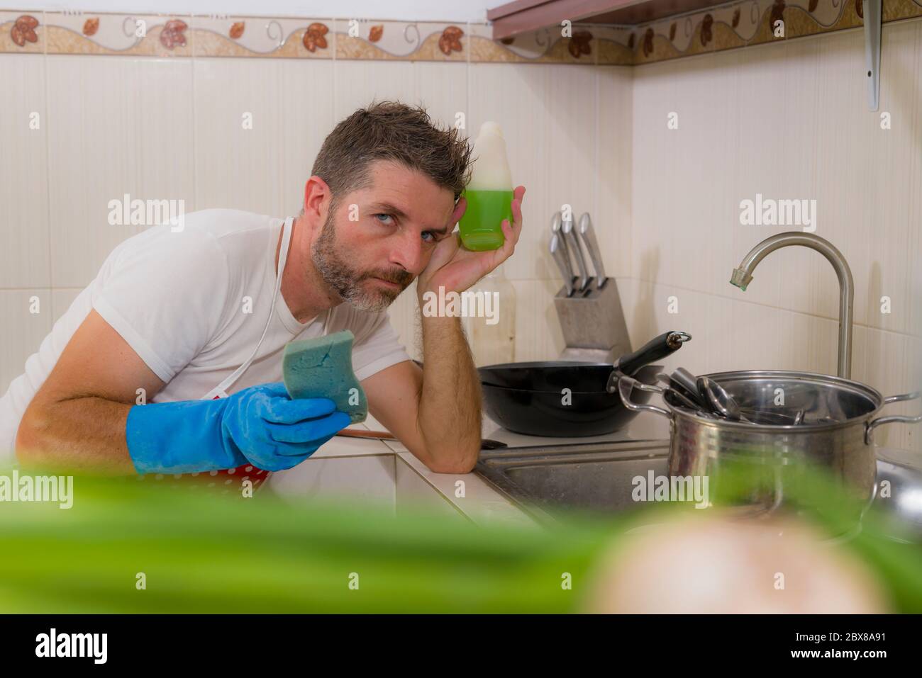 Overworked Cook domestic chores stress - lifestyle portrait of young attractive ...