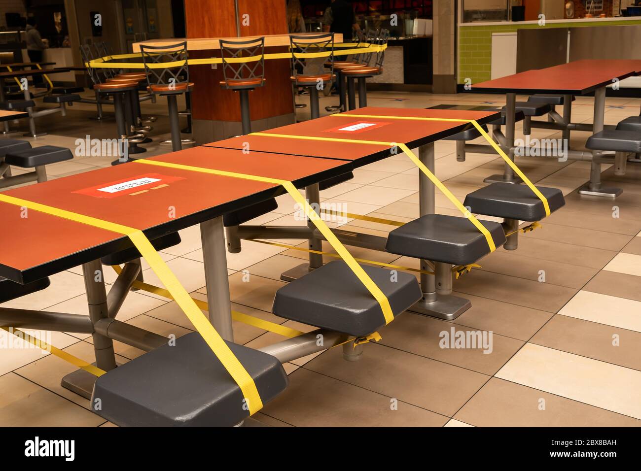 Social distancing rules in practice alternate seating in public food