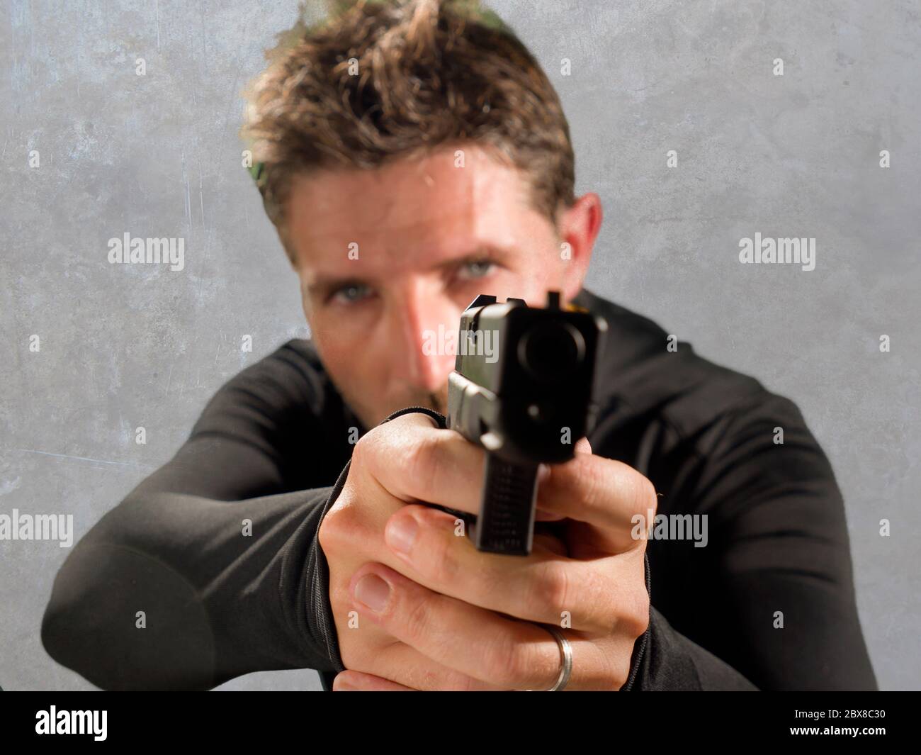 gun pointing at camera stock photo