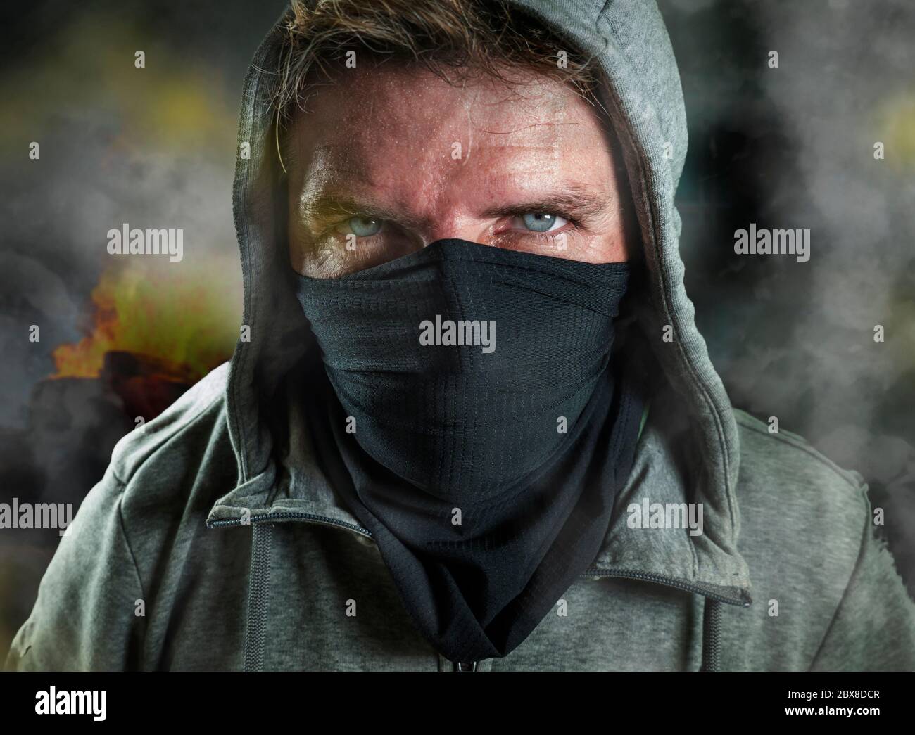 young man as ultra and radical anarchist rioter . furious antifa ...