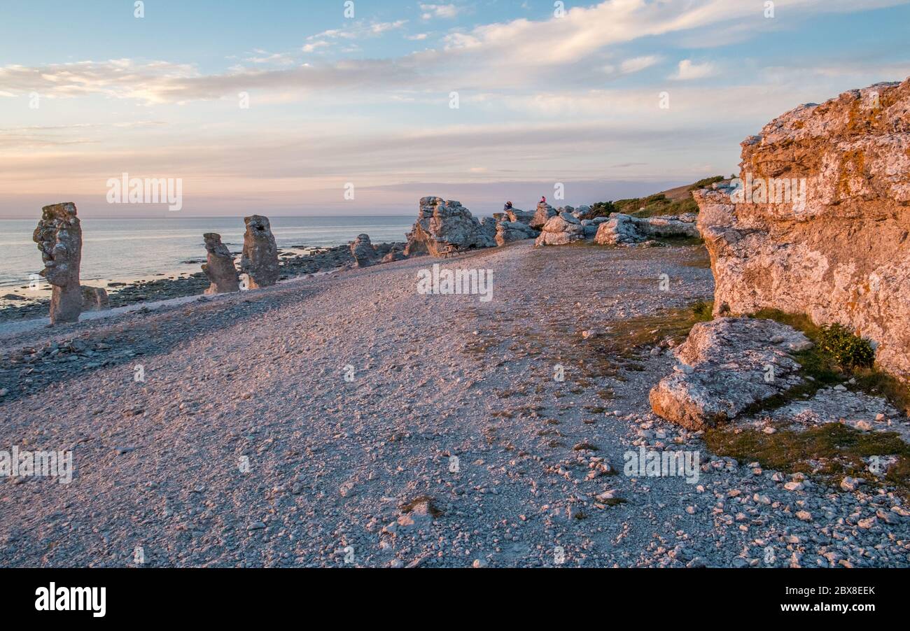 Sunset at Langhammars on Fårö island in the Baltic sea. Langhammars is famous for its collection of limestone sea stacks. Stock Photo