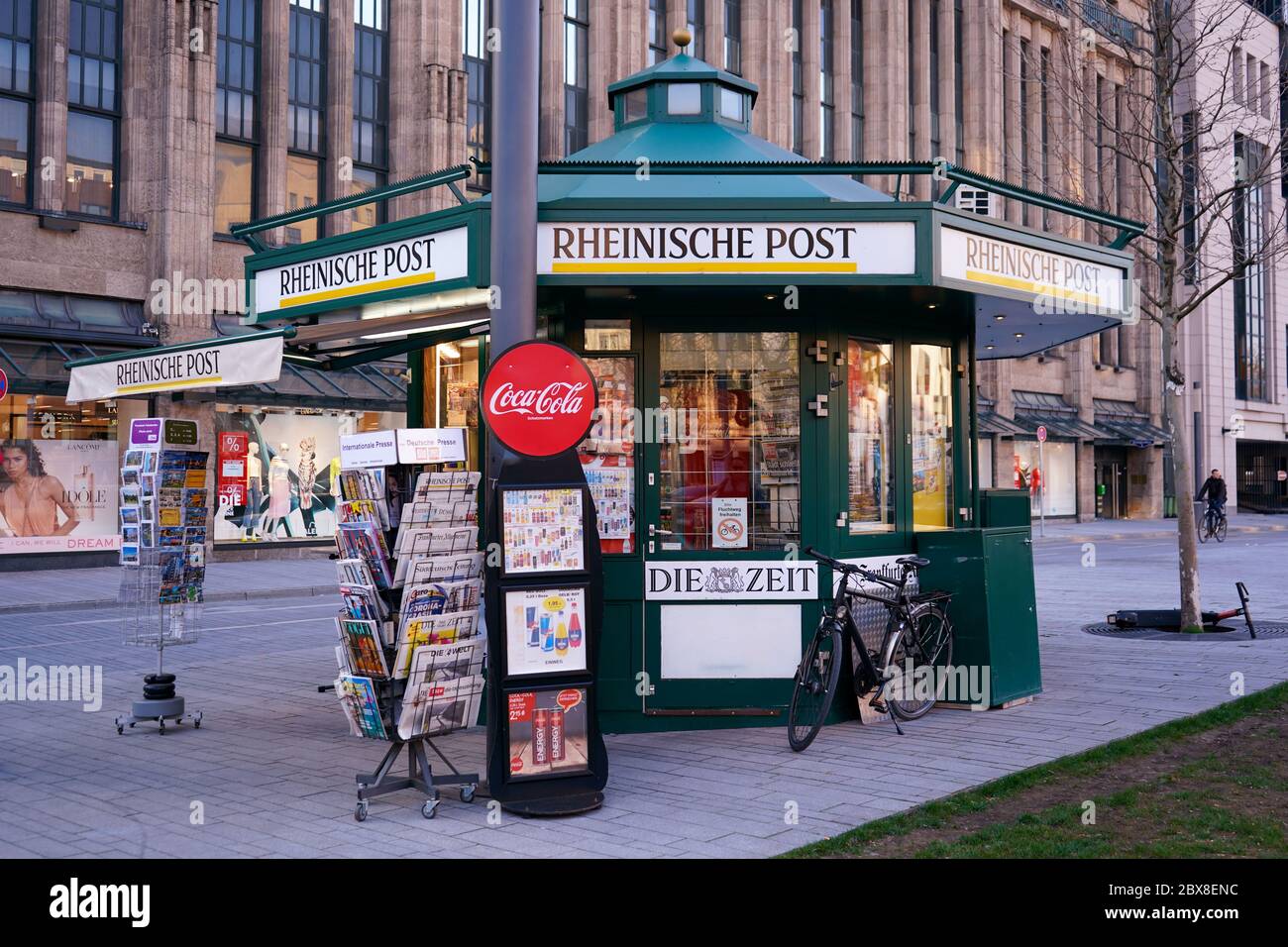 Typical German newsstand (kiosk) at Corneliusplatz. German kiosks usually sell magazines, newspapers, cigarettes, souvenirs, sweets and beverages. Stock Photo
