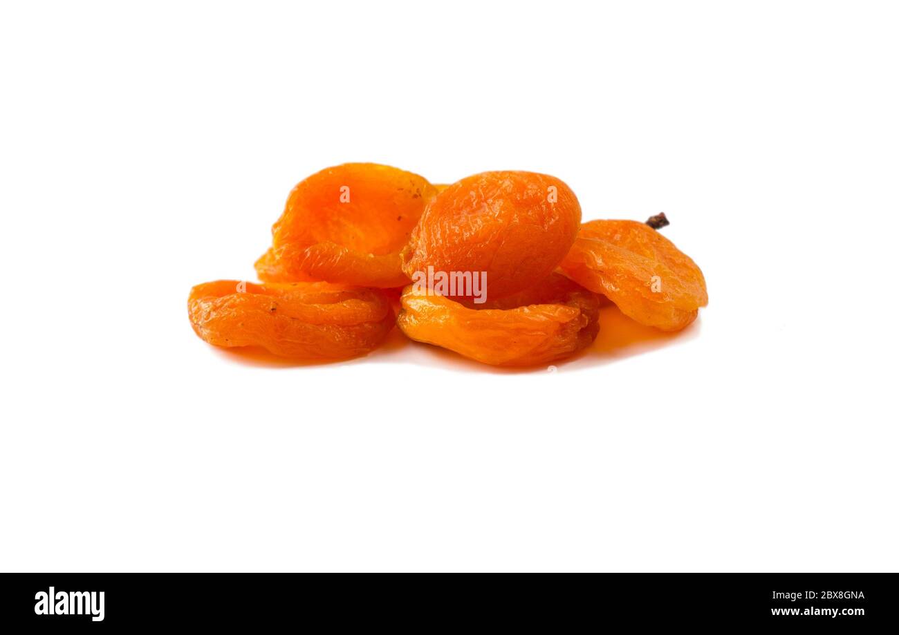 Heap of dried apricots isolated on white background. Dried fruit with