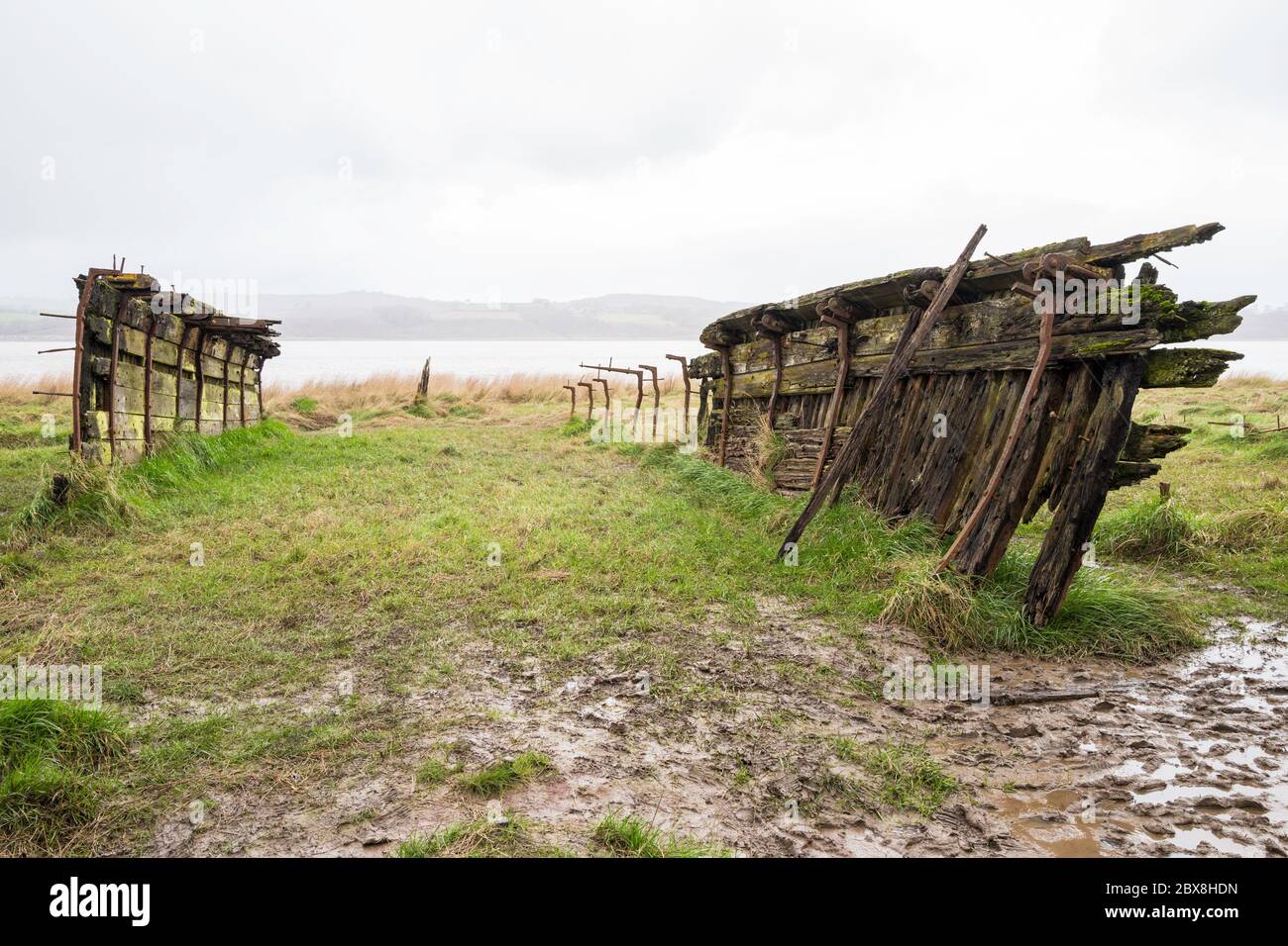 The schooner 'Dispatch' is among the boats beached beside the River Severn to reinforce the river banks.  Purton Hulks, Gloucestershire, England, UK. Stock Photo