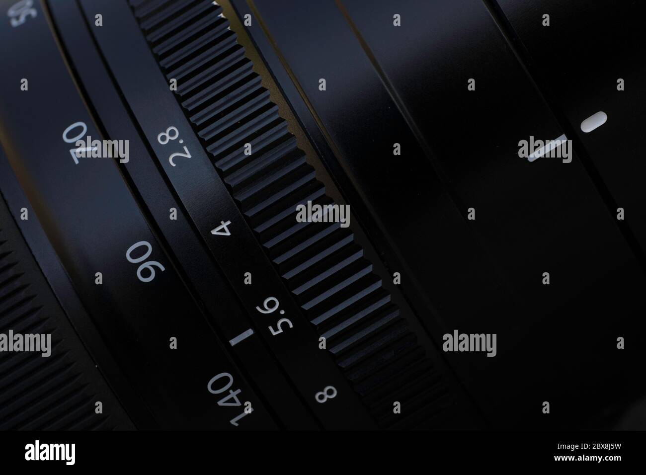 Detail of a camera lens with diaphragm and focus ring for photography