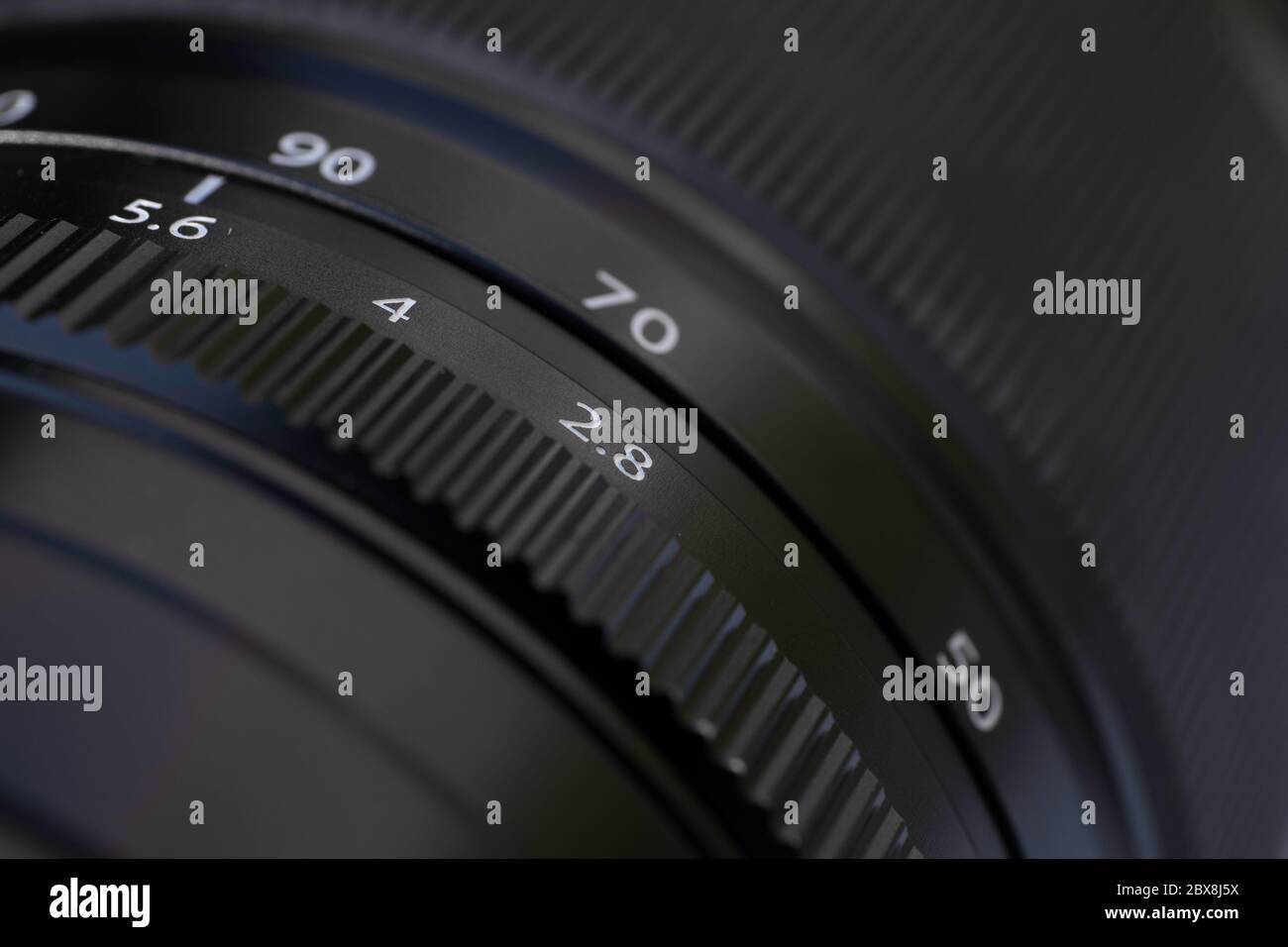Detail of a camera lens with diaphragm and focus ring for photography
