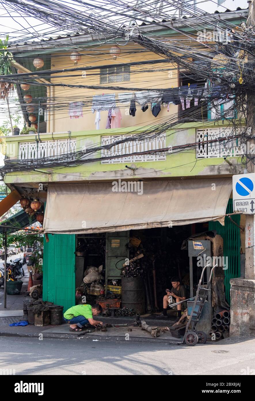 Car parts workshop in the Talad Noi area of Chinatown, Bangkok, Thailand, Southeast Asia. Stock Photo