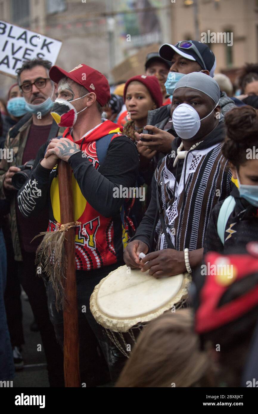 Melbourne, Australia. 06th June, 2020. An Indigenous Australian didgeridoo player and an African drummer stand side by side at a protest in Melbourne, Australian to stop Black Deaths in Custody and seek Justice for George Floyd. 06 Jun 2020 Credit: Michael Currie/Alamy Live News Stock Photo