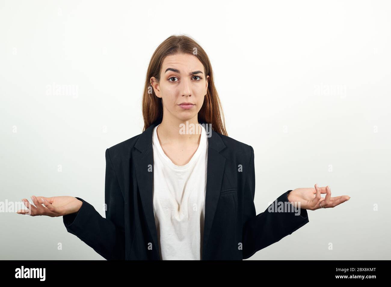 Palms up, place product here, raising arms wide spread is catching something. Stock Photo