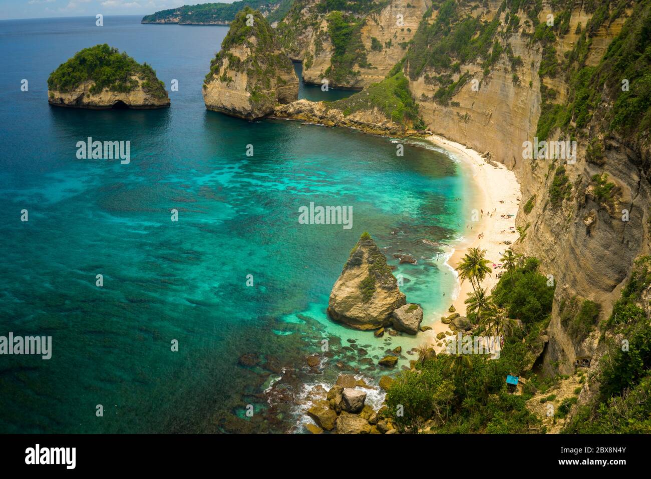 beautiful aerial view of tropical paradise beach and rock cliff with