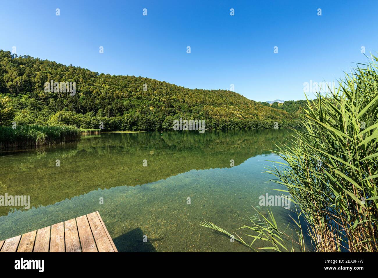 Lago di Levico, small beautiful lake in Italian Alps, Valsugana valley, Levico Terme town, Trento province, Trentino Alto Adige, Italy, Europe Stock Photo