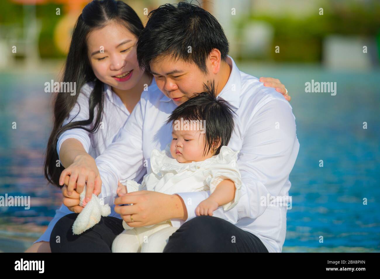 Lifestyle Portrait Of Young Cheerful And Sweet Wife And Husband Couple With Mother And Father Holding Little Daughter In Asian Korean Family Enjoying Stock Photo Alamy