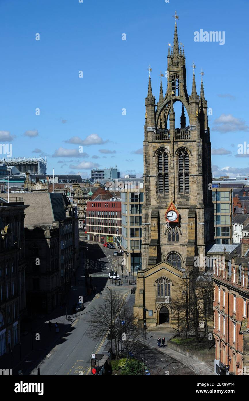 Elevated view of St. Nicholas Cathedral and St. Nicholas Street (with no traffic) with city skyline in background, Newcastle upon Tyne, England, UK Stock Photo