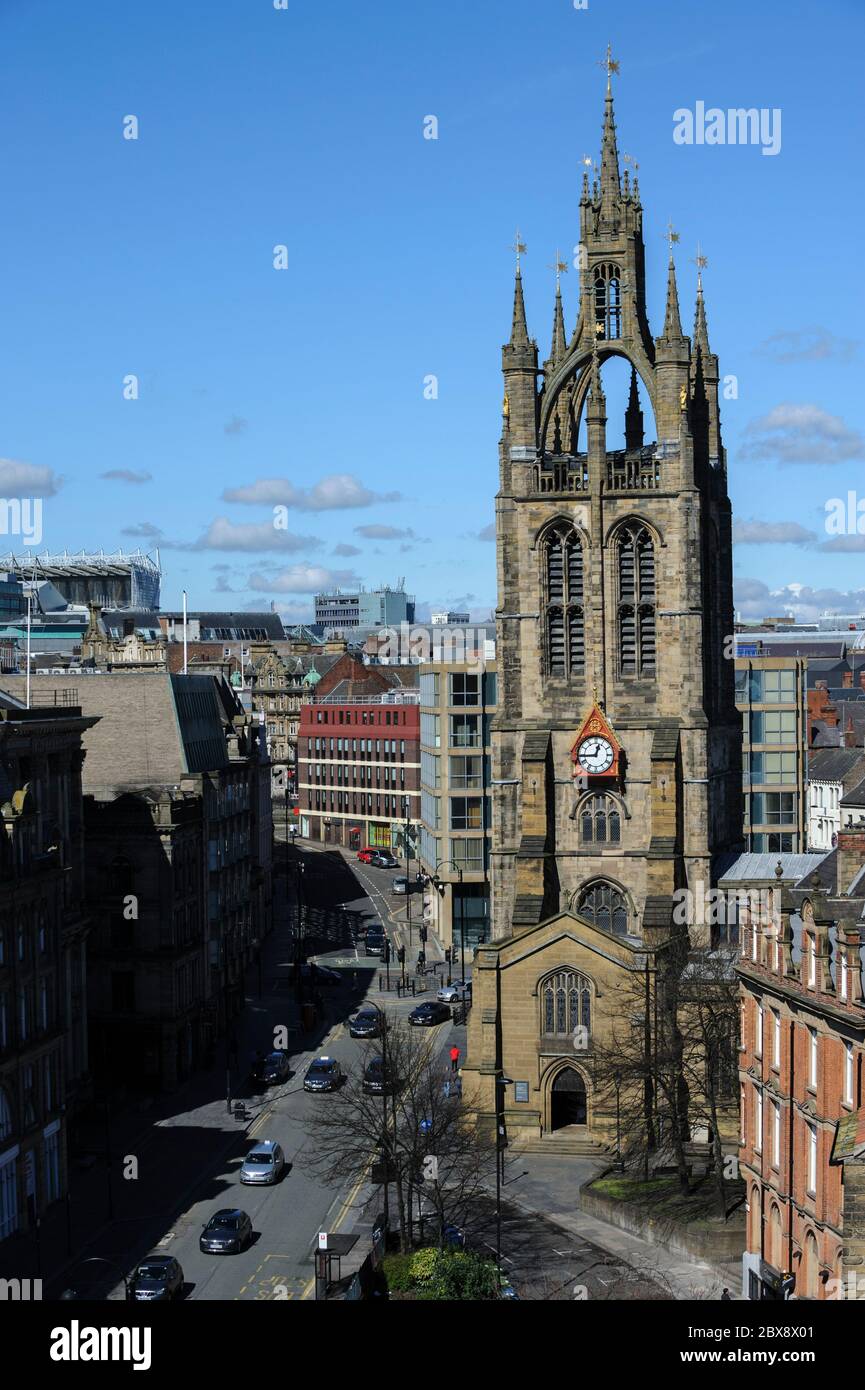 Elevated view of St. Nicholas Cathedral and St. Nicholas Street (with traffic) with city skyline in background, Newcastle upon Tyne, England, UK Stock Photo