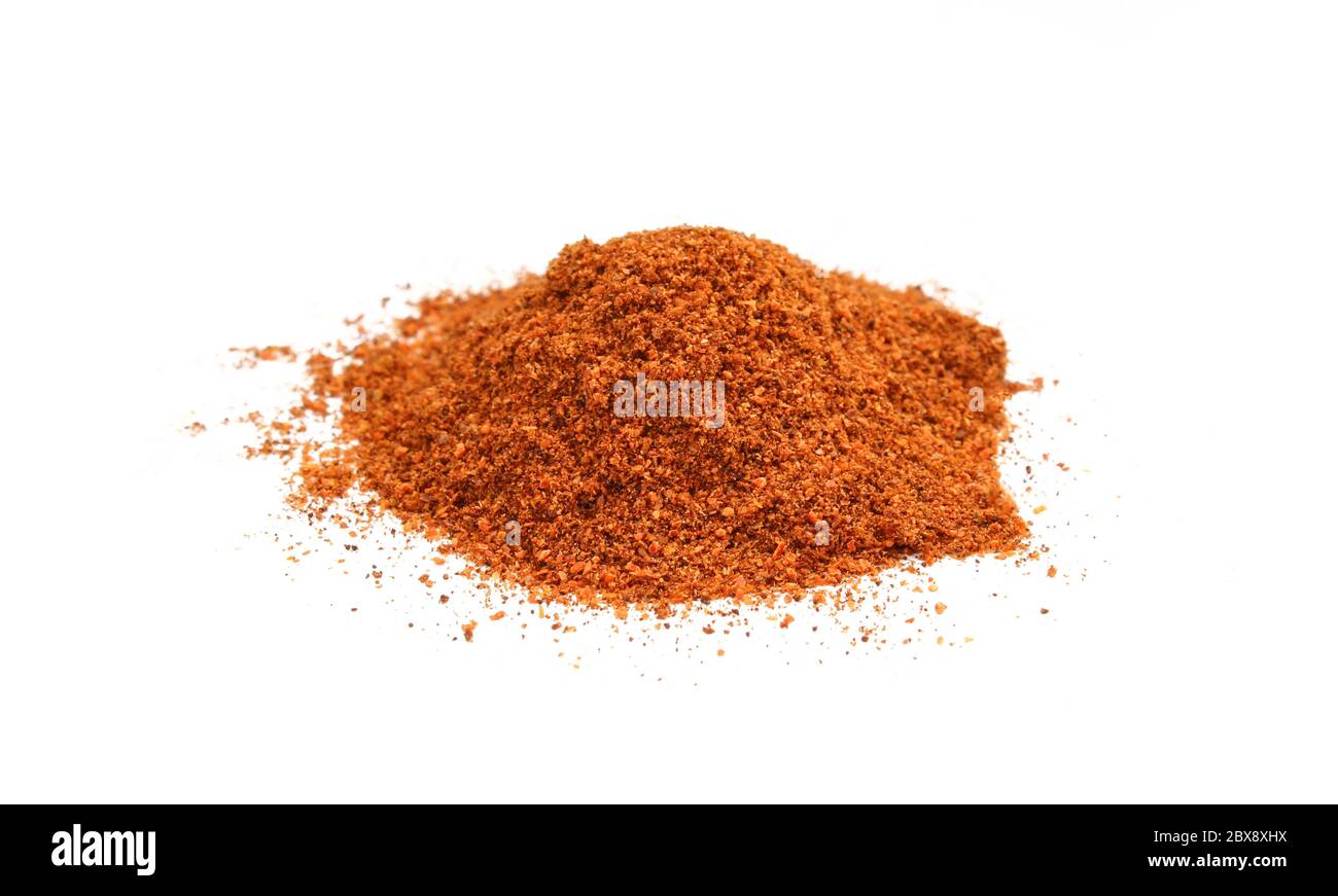 Red pepper powder isolated on white background. Dry and grinded Stock