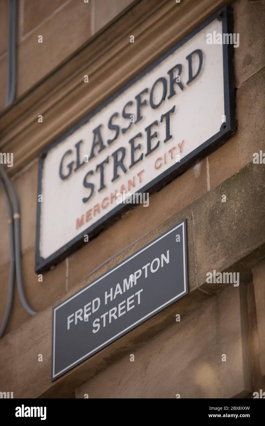 Glasgow, UK, 6th June 2020. Activists of the Celtic FC Green Brigade (ultra-fans) have renamed streets in the Merchant City which commemorate the historical fathers of the city, who had connections with plantations and slavery, with the names of black civil rights activists and slaves, in a protest aimed at drawing attention to Glasgow's connections to slavery. Glassford Street, named after 18th century tobacco lord John Glassford, renamed Fred Hampton Street after the American activist and revolutionary socialist. In Glasgow, Scotland, on 6 June 2020. Photo credit: Jeremy Sutton-Hibbert/Alamy Stock Photo